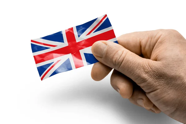 Hand holding a card with a national flag the United Kingdom — Stock Photo, Image