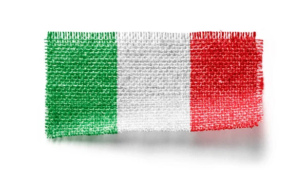 Italy flag on a piece of cloth on a white background — Stock Photo, Image