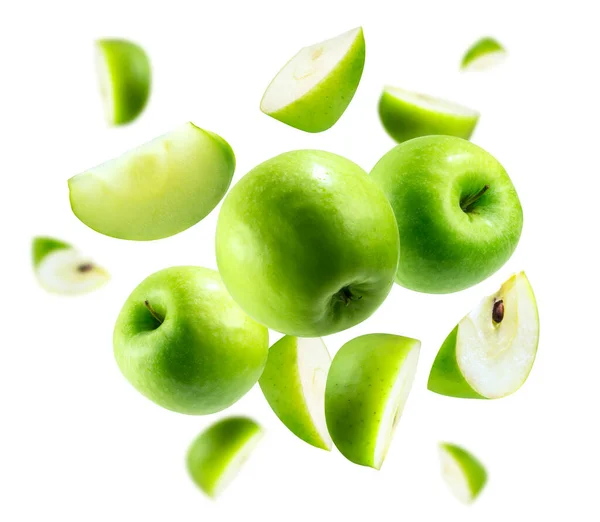 A group of green apples levitating on a white background Stock Photo
