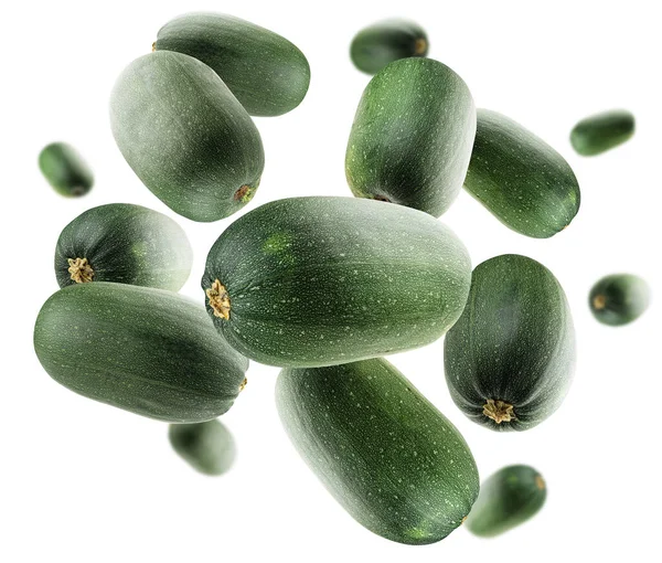 Green zucchini levitate on a white background — Stock Photo, Image