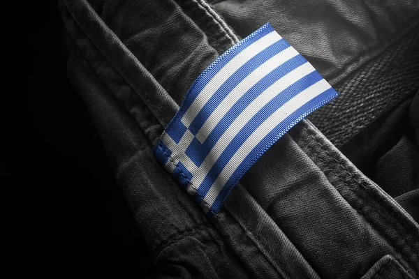 Ετικέτα για σκούρα ενδύματα με τη μορφή της σημαίας της Ελλάδας — Φωτογραφία Αρχείου