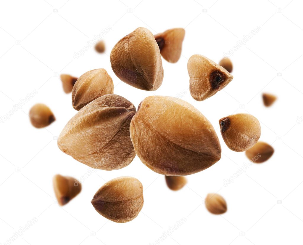 Ripe buckwheat grains levitate on a white background.