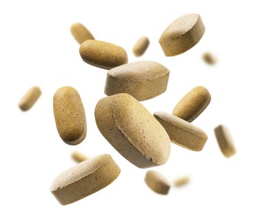 Sarı haplar beyaz arkaplanda uçar