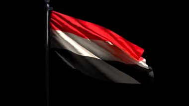 Yemen 'in ulusal bayrağı rüzgarda dalgalanıyor siyah bir arkaplanda