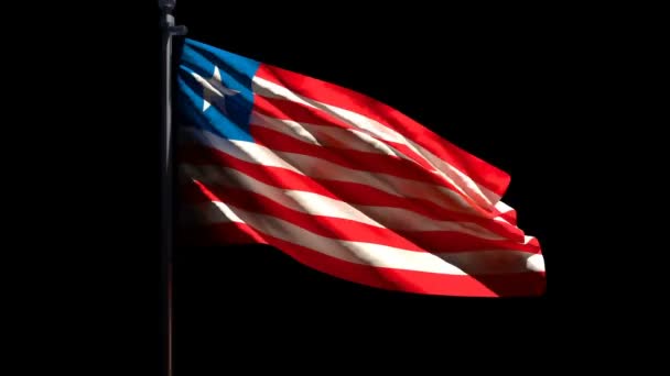 Liberias nationalflagga flyger i vinden mot en svart bakgrund — Stockvideo