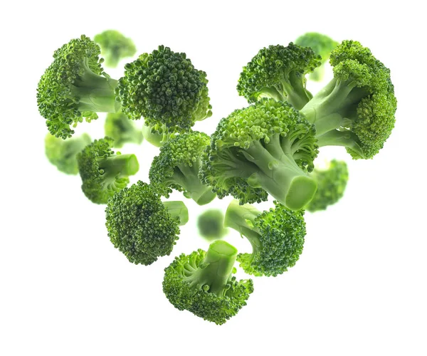 Green broccoli in the shape of a heart on a white background — Stock Photo, Image
