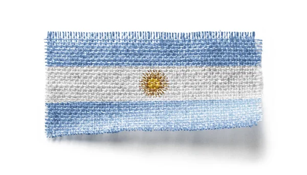 Bandeira da Argentina em um pedaço de pano em um fundo branco — Fotografia de Stock