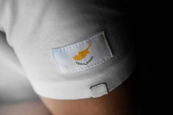 Patch of the national flag of the Cyprus on a white t-shirt