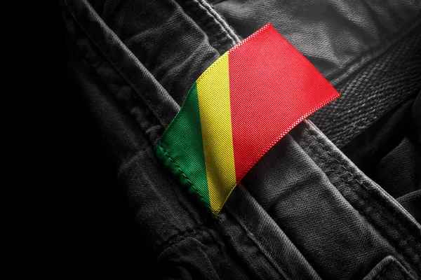 Tag on dark clothing in the form of the flag of the Congo — Stock Photo, Image