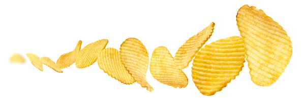 Fluted potato chips levitate on a white background — Stock Photo, Image