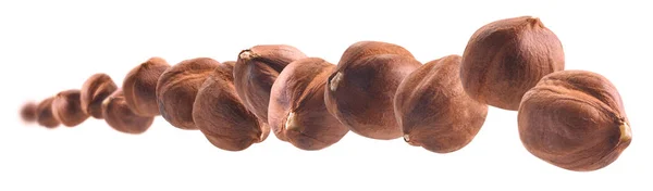 Peeled mogyoró lebegtet fehér alapon — Stock Fotó