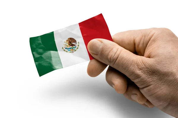 Hand hält eine Karte mit einer mexikanischen Nationalflagge — Stockfoto