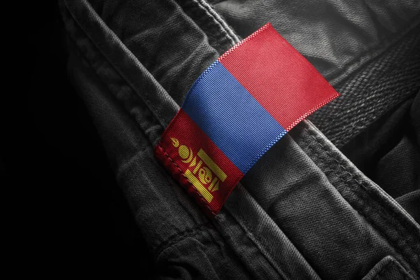 Tagg på mörka kläder i form av flagga Mongoliet — Stockfoto