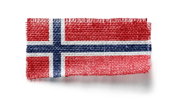 Bandeira da Noruega em um pedaço de pano em um fundo branco — Fotografia de Stock