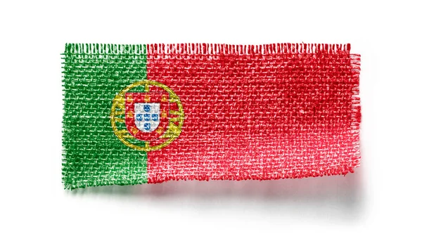 Bandeira de Portugal sobre um pedaço de pano sobre um fundo branco — Fotografia de Stock