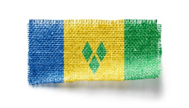 Beyaz arka planda bir kumaş parçasında Saint Vincent bayrağı