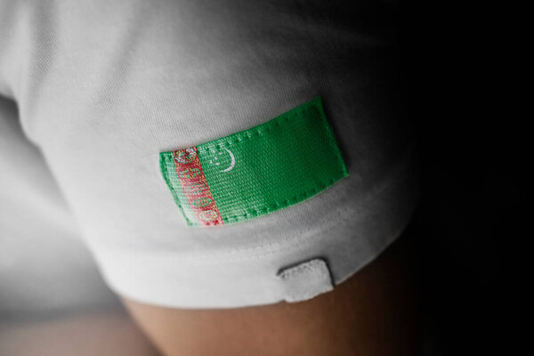 Patch of the national flag of the Turkmenistan on a white t-shirt
