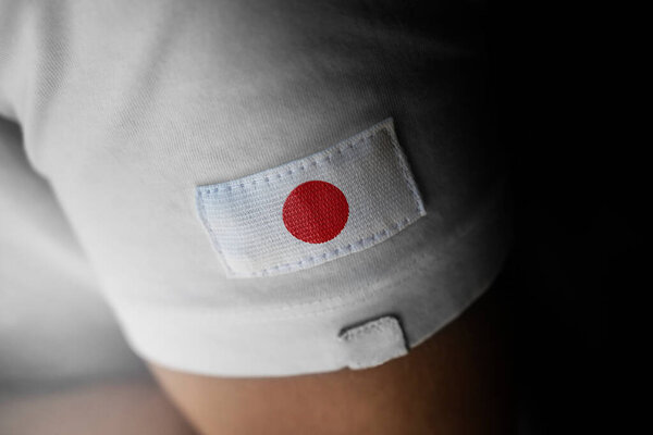 Patch of the national flag of the Japan on a white t-shirt