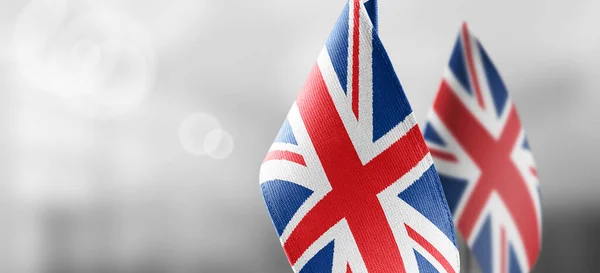 Small national flags of the United Kingdom on a light blurry background — Stock Photo, Image