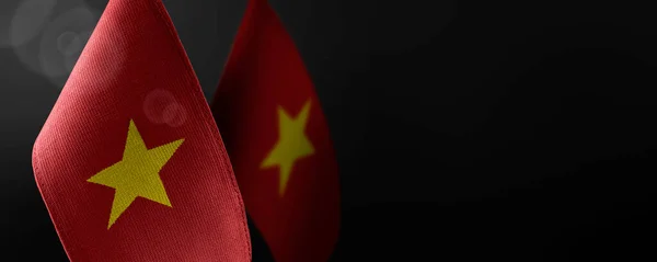 Small national flags of the Vietnam on a dark background — Stock Photo, Image