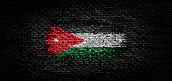 Національний прапор Йорданії на темній тканині — стокове фото