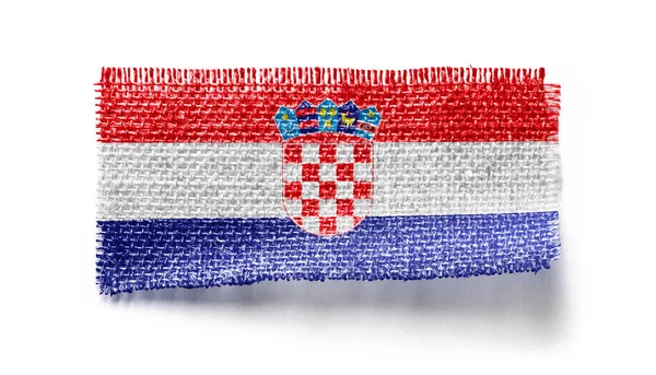 Croatia flag on a piece of cloth on a white background — Stock Photo, Image