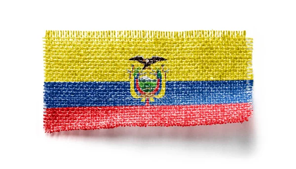 Ecuador flag on a piece of cloth on a white background — Stock Photo, Image