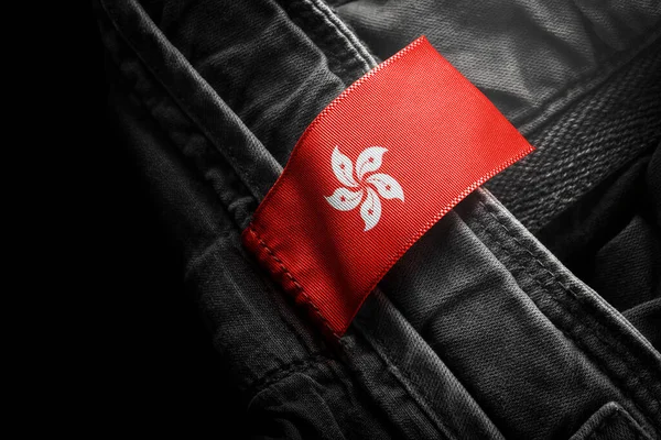 以香港国旗为形式的深色衣服标签 — 图库照片