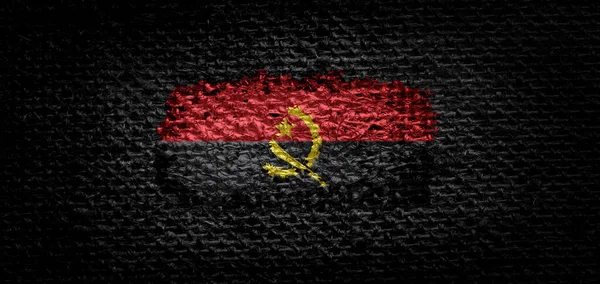Государственный флаг Анголы на темной ткани — стоковое фото