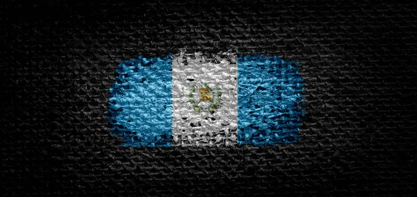 National flag of the Guatemala on dark fabric — Stock Photo, Image