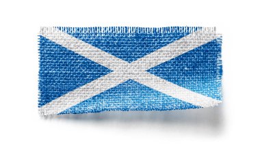 Beyaz arka planda bir kumaş parçasında İskoçya bayrağı