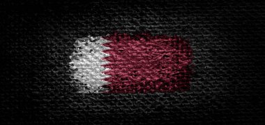 Katar 'ın ulusal bayrağı koyu kumaşta