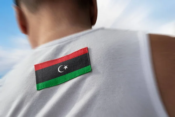 Die libysche Nationalflagge auf dem Rücken der Athleten — Stockfoto