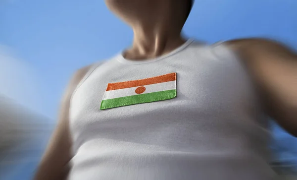 The national flag of Niger on the athletes chest — Stock Photo, Image