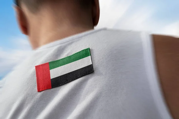 The national flag of United Arab Emirates on the athletes back — Stock Photo, Image