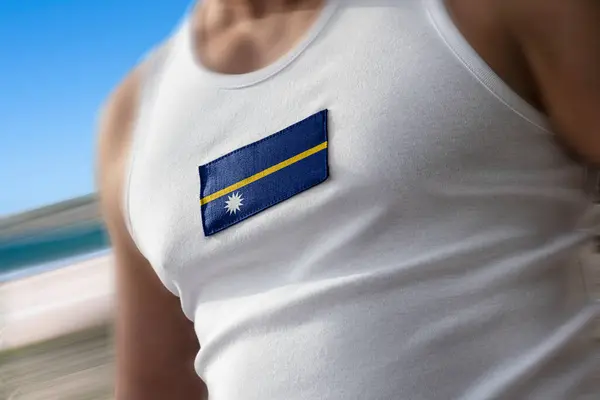 The national flag of Nauru on the athletes chest — Stock Photo, Image