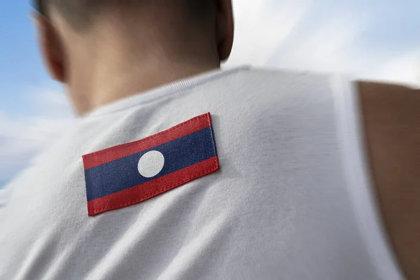 Die Nationalflagge von Laos auf dem Rücken der Athleten — Stockfoto