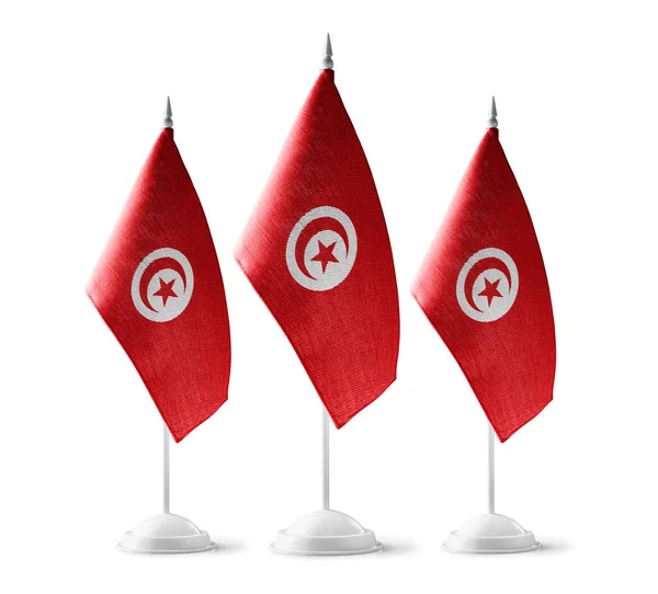 Pequeñas banderas nacionales de Túnez sobre un fondo blanco — Foto de Stock