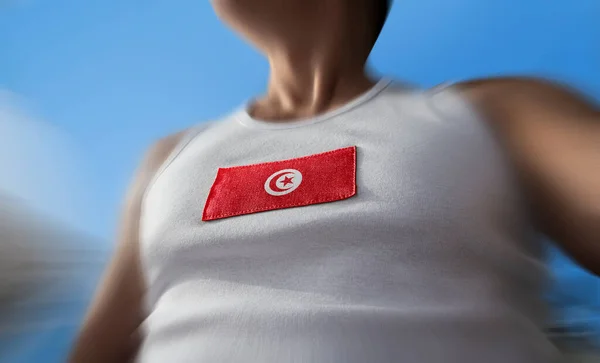 The national flag of Tunisia on the athletes chest — Stock Photo, Image