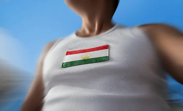 The national flag of Tajikistan on the athletes chest — Stock Photo, Image