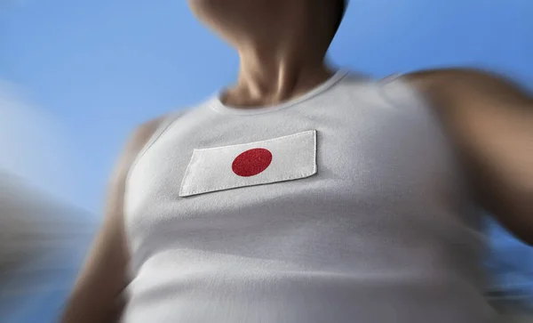 The national flag of Japan on the athletes chest — Stock Photo, Image