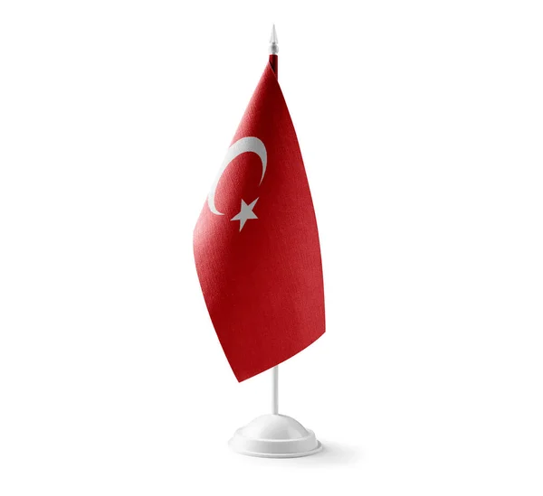 Pequena bandeira nacional da Turquia sobre um fundo branco — Fotografia de Stock
