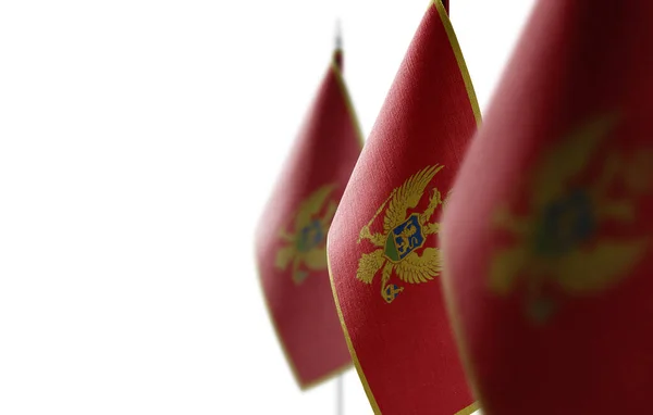 Невеликі національні прапори Чорногорії на білому тлі — стокове фото
