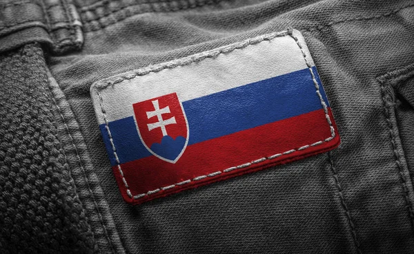 Tag auf dunkler Kleidung in Form der Flagge der Slowakei — Stockfoto
