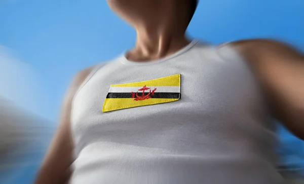 The national flag of Brunei on the athletes chest — Stock Photo, Image