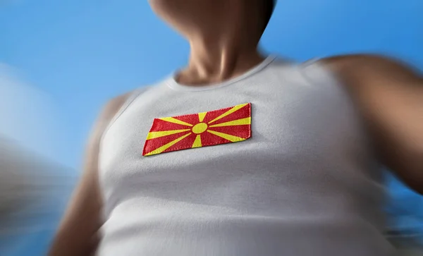 La bandera nacional de Macedonia en el pecho de los atletas — Foto de Stock