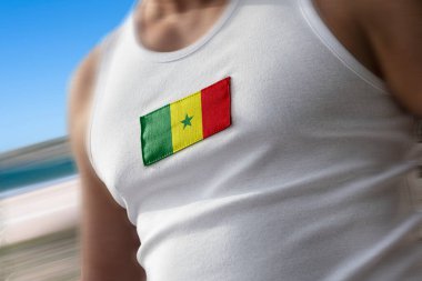 The national flag of Senegal on the athletes chest clipart