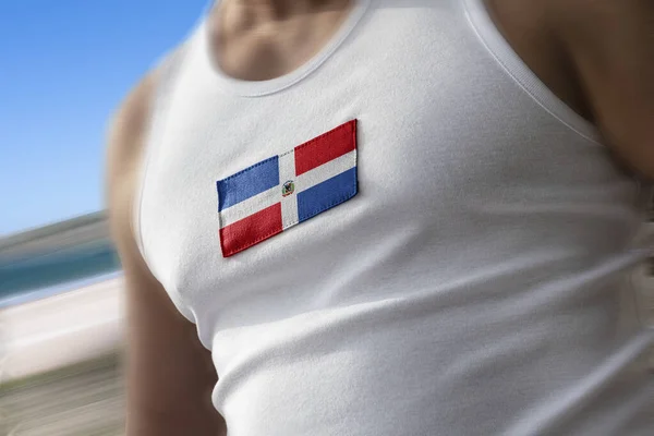운동 선수들의 가슴에 걸려 있는 도미니카나의 국기 — 스톡 사진