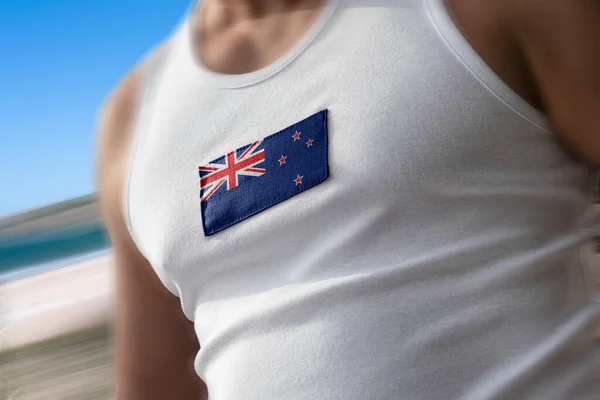 La bandera nacional de Nueva Zelanda en el pecho de los atletas —  Fotos de Stock