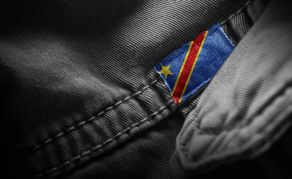 Etiqueta en la ropa oscura en forma de la bandera de la República Democrática del Congo —  Fotos de Stock
